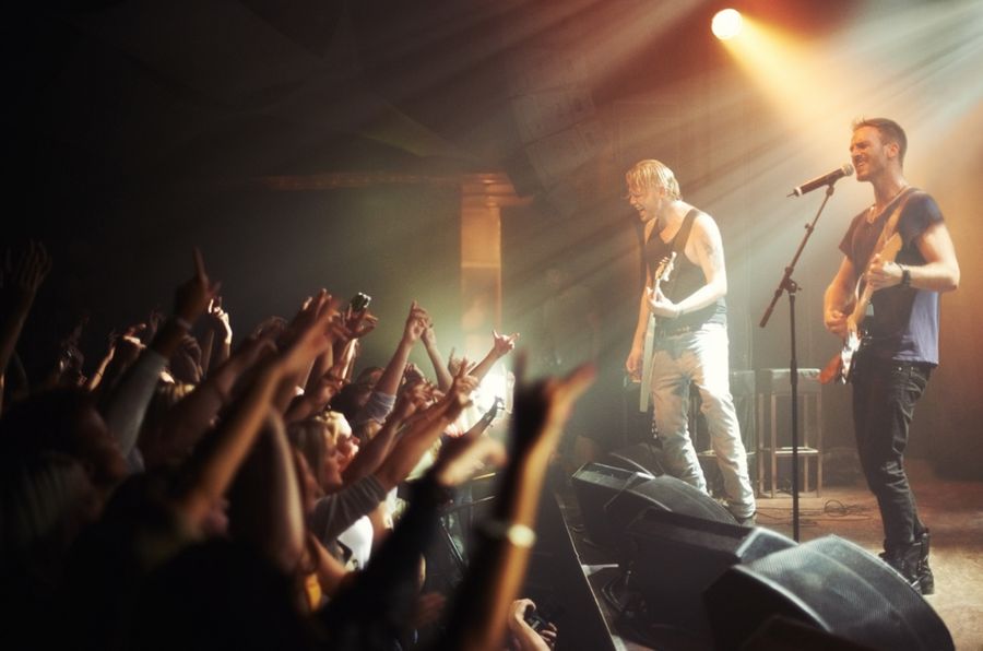 singers on the stage at a concert