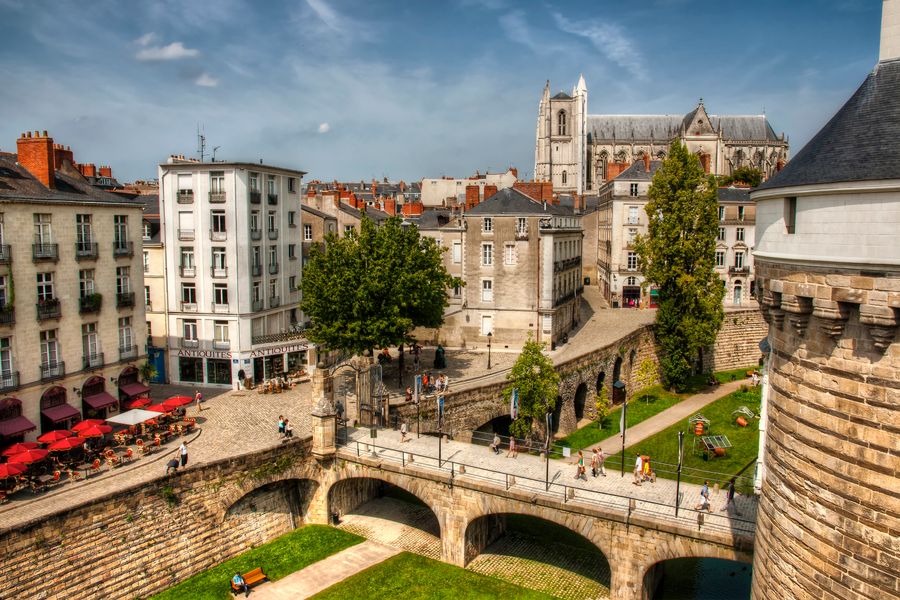 A photo of Nantes taken from up high, with a cathedral in the background.