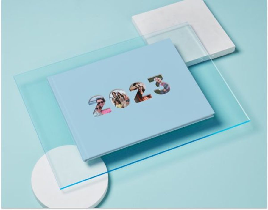 An A4 Year Photo Book, with a light blue cover and a cut out of 